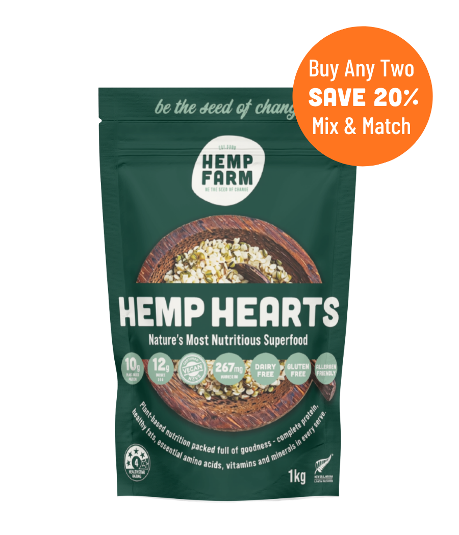 A 1kg stand-up pouch of Hemp Farm Hemp Hearts superfood, shown on a plain white background with an orange promotional badge in the top right that reads 'Buy Any Two SAVE 20% Mix & Match'. The pouch is dark green with white text and a photo of hemp hearts in a wooden bowl on the front.