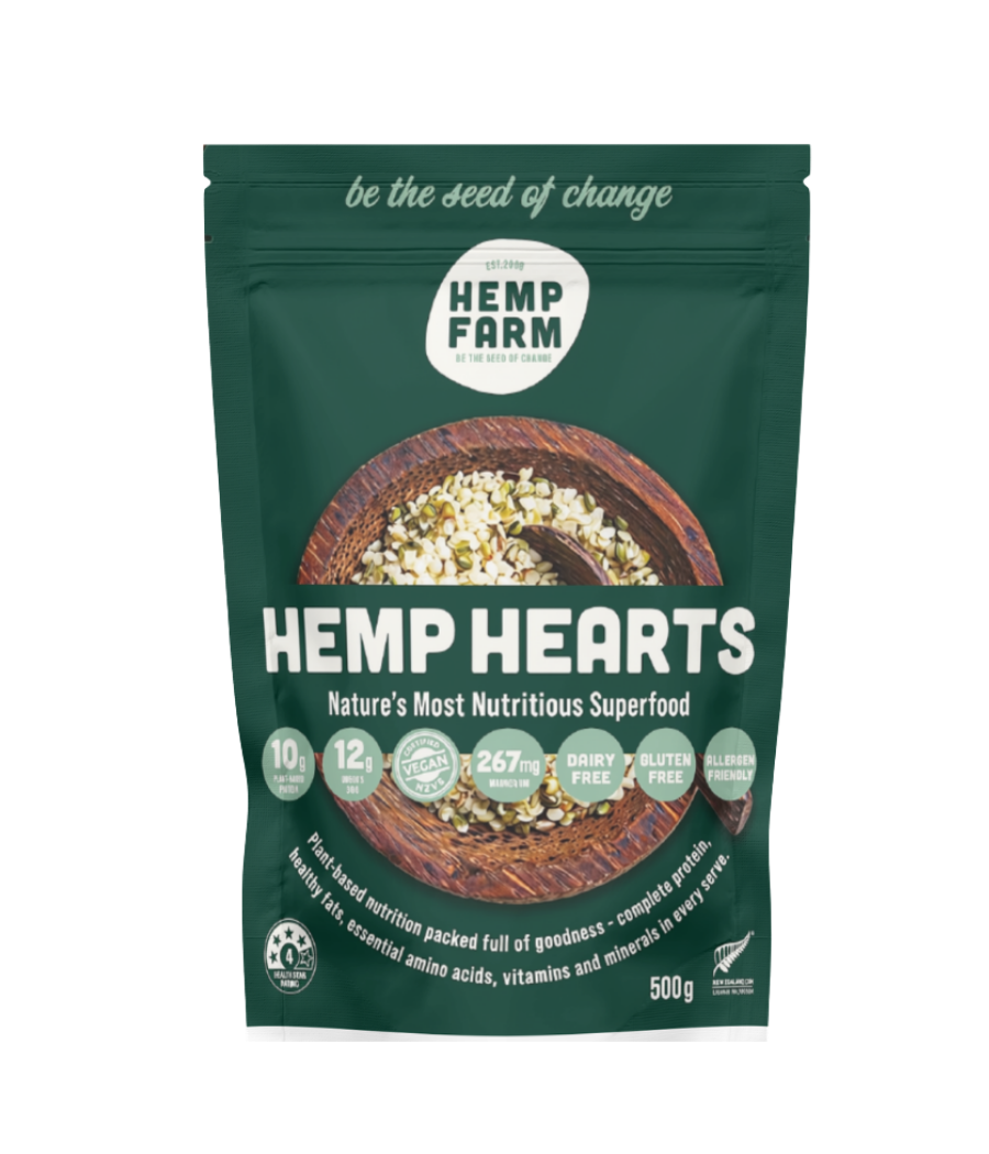 A 500g stand-up pouch of Hemp Farm Hemp Hearts superfood, featuring a dark green background with a central image of a wooden bowl filled with the hemp hearts.