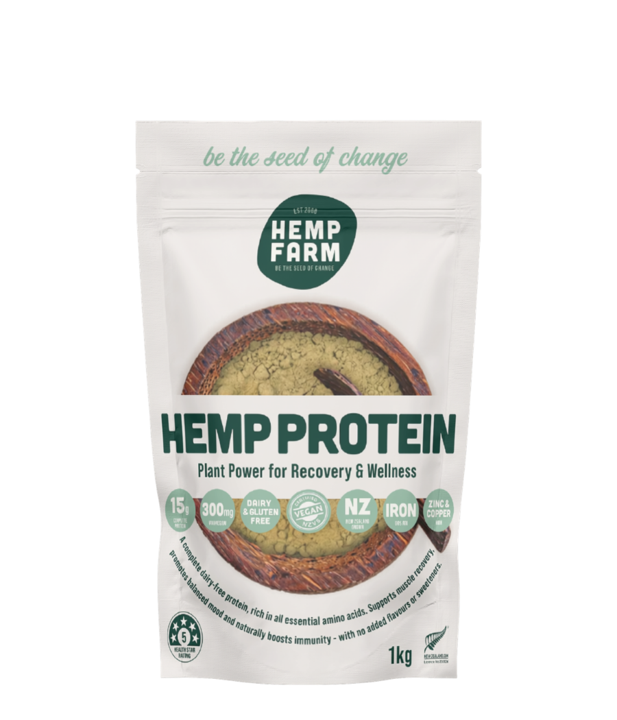 A 1kg stand-up pouch of Hemp Farm Hemp Protein powder on a plain white background. The packaging is white with dark green text and logo, featuring a circular window showing the green protein powder inside.
